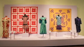 Women dresses on display are inspired by Hawaiian quilts.