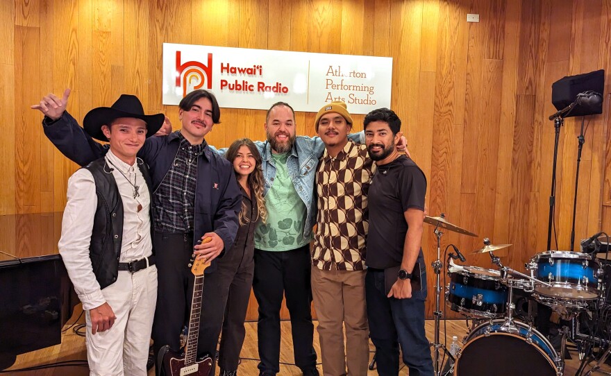 Left to right: Kainalu Kolivas (keys), Boris Garcia (guitar), Analiese Esopenko (vocals), Riley Kalā Paʻakaula (bass guitar), John Sabugo (drums) and HPR Multimedia Producer Ananddev Banerjee in the Atherton Performing Arts Studio.