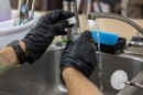 FILE - A Navy contractor collects a water sample from a kitchen sink in a residence on Joint Base Pearl Harbor-Hickam, Hawaiʻi. (U.S. Navy photo by Mass Communication Specialist Seaman Krystal Diaz)