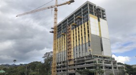 A new housing tower is seen under construction in Honolulu on March 27, 2023. (AP Photo/Audrey McAvoy)