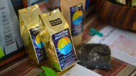 File - Coffee bags sit on display at the 2023 Kona Coffee Festival on Hawaiʻi Island.