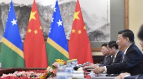 FILE - Chinese President Xi Jinping talks to Prime Minister of the Solomon Islands Manasseh Sogavare, not pictured, during their meeting at the Diaoyutai State Guesthouse in Beijing, Wednesday, Oct. 9, 2019. Beijing is increasingly targeting its South Pacific political allies with its shrinking aid budget as competition intensifies with the United States for influence in the region, Sydney’s Lowy Institute has reported in its latest annual analysis of regional assistance.