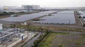 FILE - In this 2012 photo, solar panels cover the 11-hectare compound of the Ukishima Solar Power Station in Kawasaki near Tokyo.