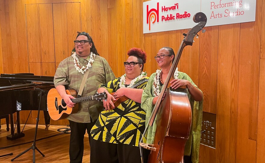 Cousins Lina Robins-Tamure, Heather Kapuaokamakahala Kalua and Jordan ʻĀina Asing come together as the beloved Hawaiian music trio, ʻUheʻuhene.