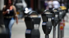 A row of parking meters lines O'Farrell Street in San Francisco. The city issues 1.5 million tickets a year.