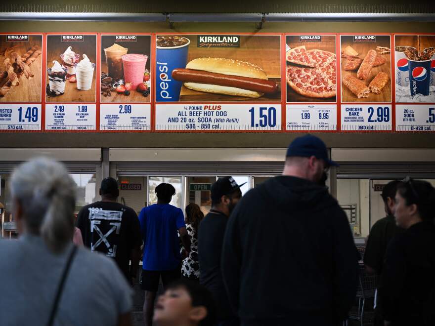 Customers wait in line at a Costco food court in Hawthorne, California.  