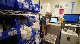 FILE PHOTO - A registered nurse retrieves medications for her patients at Providence Cedars-Sinai Tarzana Medical Center in Los Angeles on Thursday, March 11, 2021. (AP Photo/Damian Dovarganes)