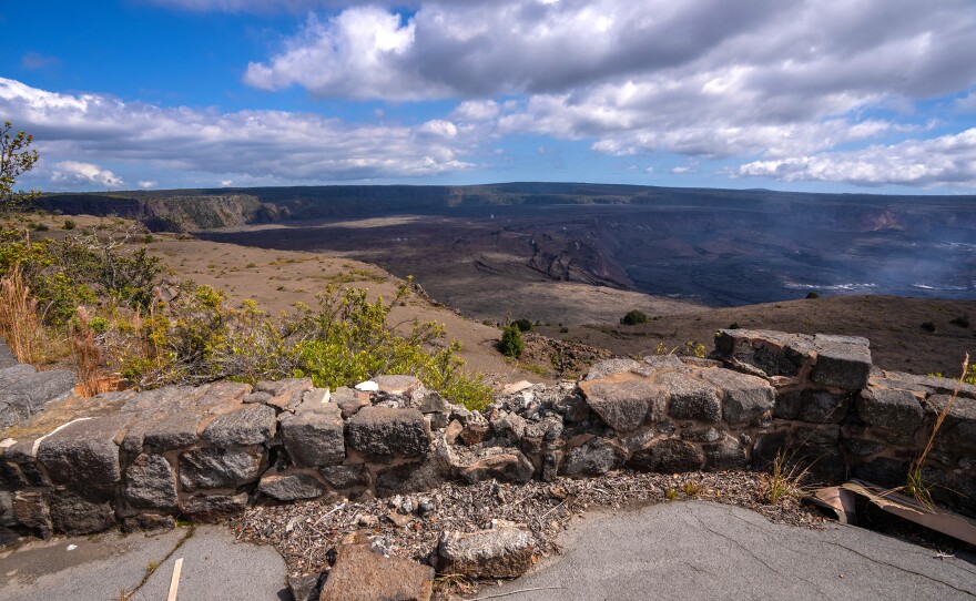 .A cracked and damaged rock wall overlooking Kīlauea caldera on the Jaggar Museum viewing platform