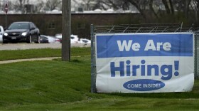 A hiring sign is displayed in Wheeling, Ill., Thursday, May 5, 2022. (AP Photo/Nam Y. Huh)