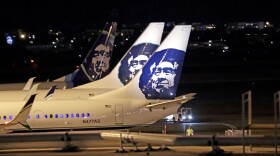 Alaska Airlines planes sit on the tarmac at Sea-Tac International Airport Friday evening, Aug. 10, 2018, in SeaTac, Wash.