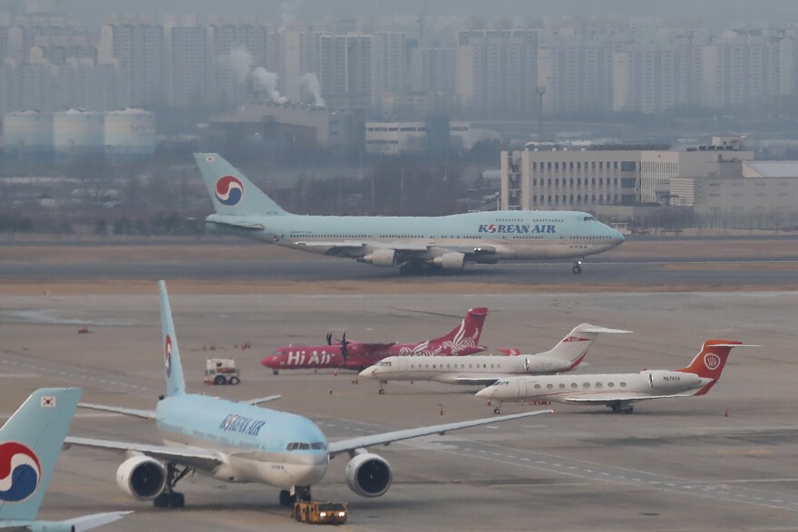 FILE - A South Korean plane at Gimpo International Airport in Seoul, South Korea, Friday, Jan. 31, 2020.