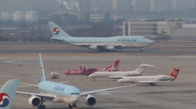 FILE - A South Korean plane at Gimpo International Airport in Seoul, South Korea, Friday, Jan. 31, 2020.