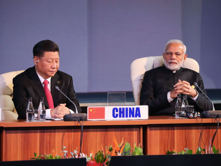 (LtoR) China's President Xi Jinping and India's Prime Minister Narendra Modi attend a session meeting during the 10th BRICS summit (acronym for the grouping of the world's leading emerging economies, namely Brazil, Russia, India, China and South Africa) on July 27, 2018 in Johannesburg, South Africa. (Photo by MIKE HUTCHINGS / POOL / AFP)        (Photo credit should read MIKE HUTCHINGS/AFP via Getty Images)