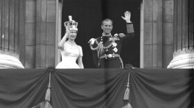 Britain's Queen Elizabeth II and Prince Philip, Duke of Edinburgh, wave to supporters from the balcony at Buckingham Palace, following her coronation at Westminster Abbey. London, June. 2, 1953. (AP Photo/Priest)