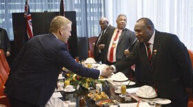 Papua New Guinea Prime Minister James Marape, right, shakes hands with New Zealand Prime Minister Chris Hipkins at a breakfast meeting in Port Moresby, Papua New Guinea, Monday, May 22, 2023.