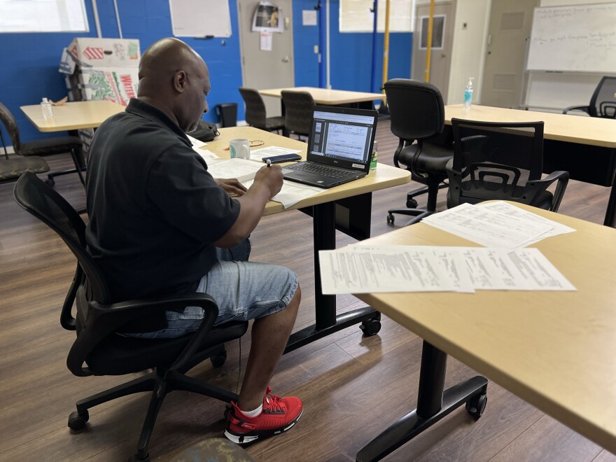 Thaddeus Wright attends a juvenile detention docket via Zoom on Aug. 14, 2023 while working out of the Tampa community center that hosts the Youth Gun Offender program. Managers attend court every morning to identify teens who may qualify to participate.